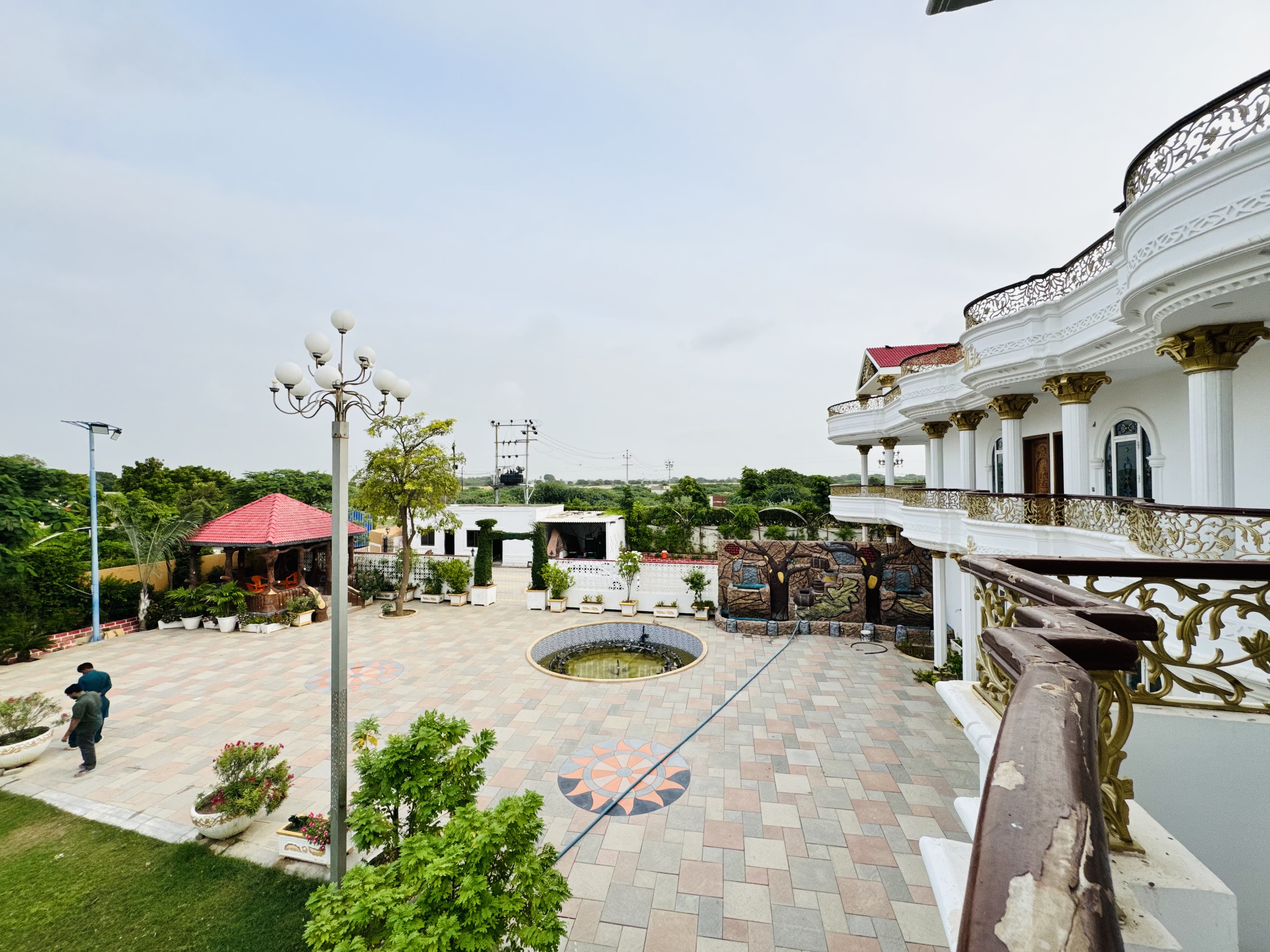 Eden White Palace farmhouse exterior surrounded by gardens
